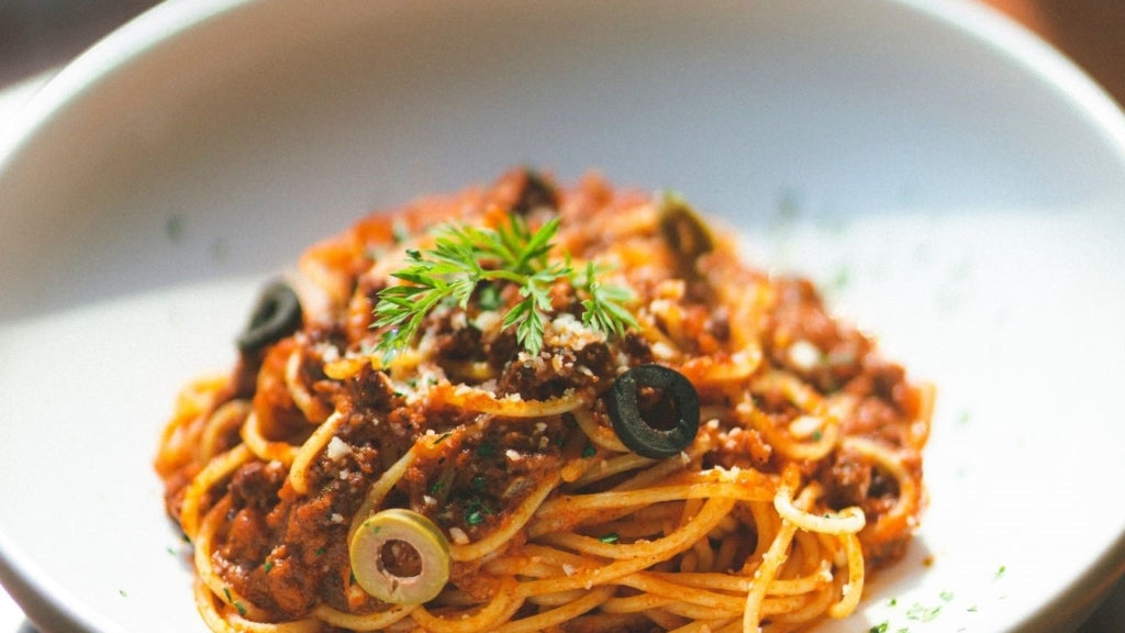 Meaty Spaghetti with Olives and Parmesan Cheese
